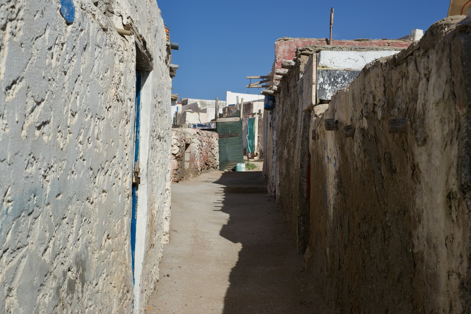 a narrow alley between stone buildings