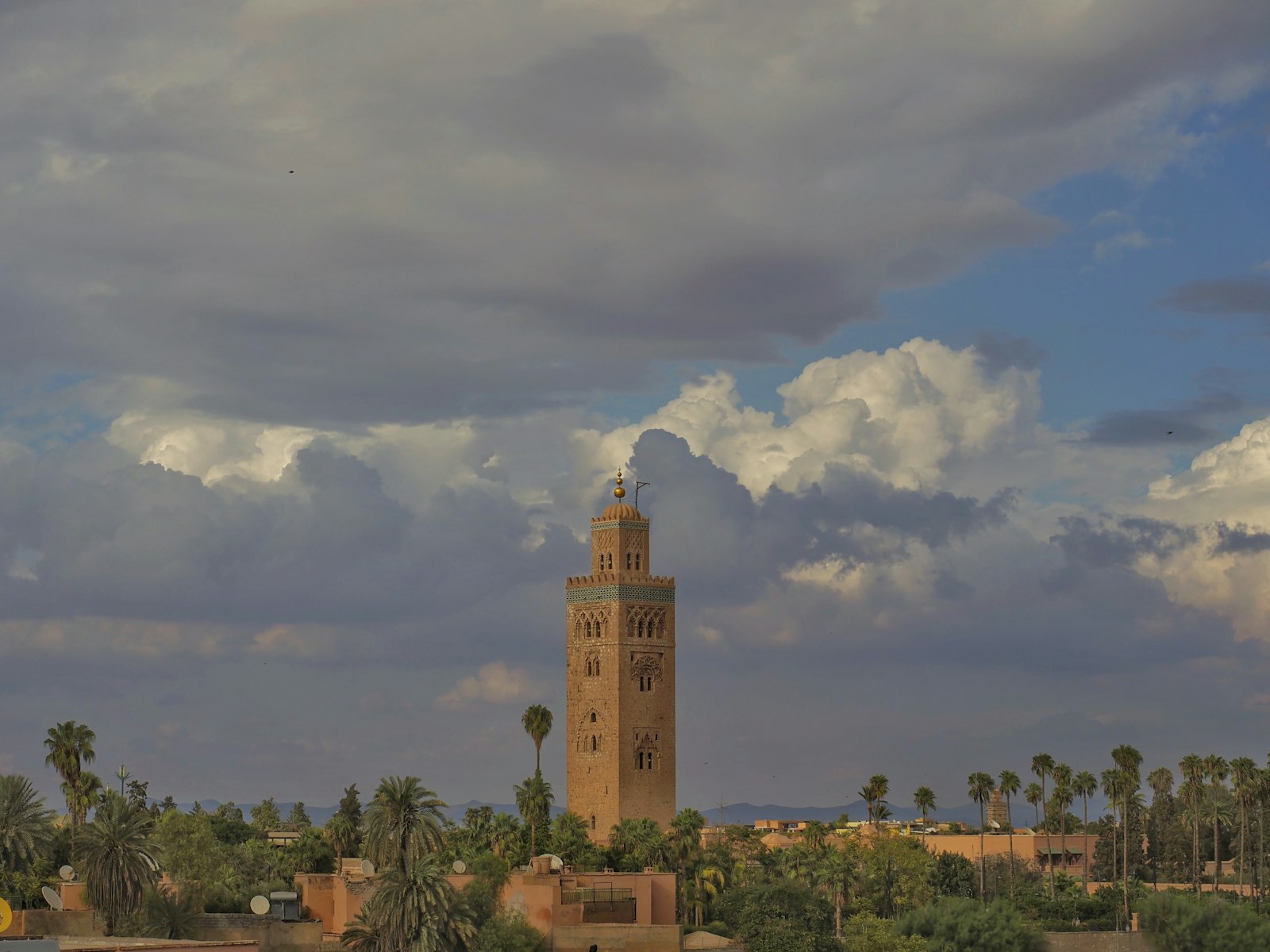 A tall tower with a clock on the top of it