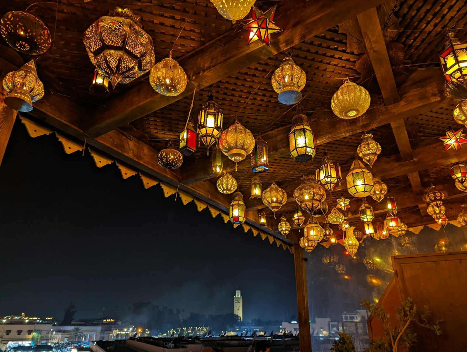 a room filled with lots of lights hanging from the ceiling
