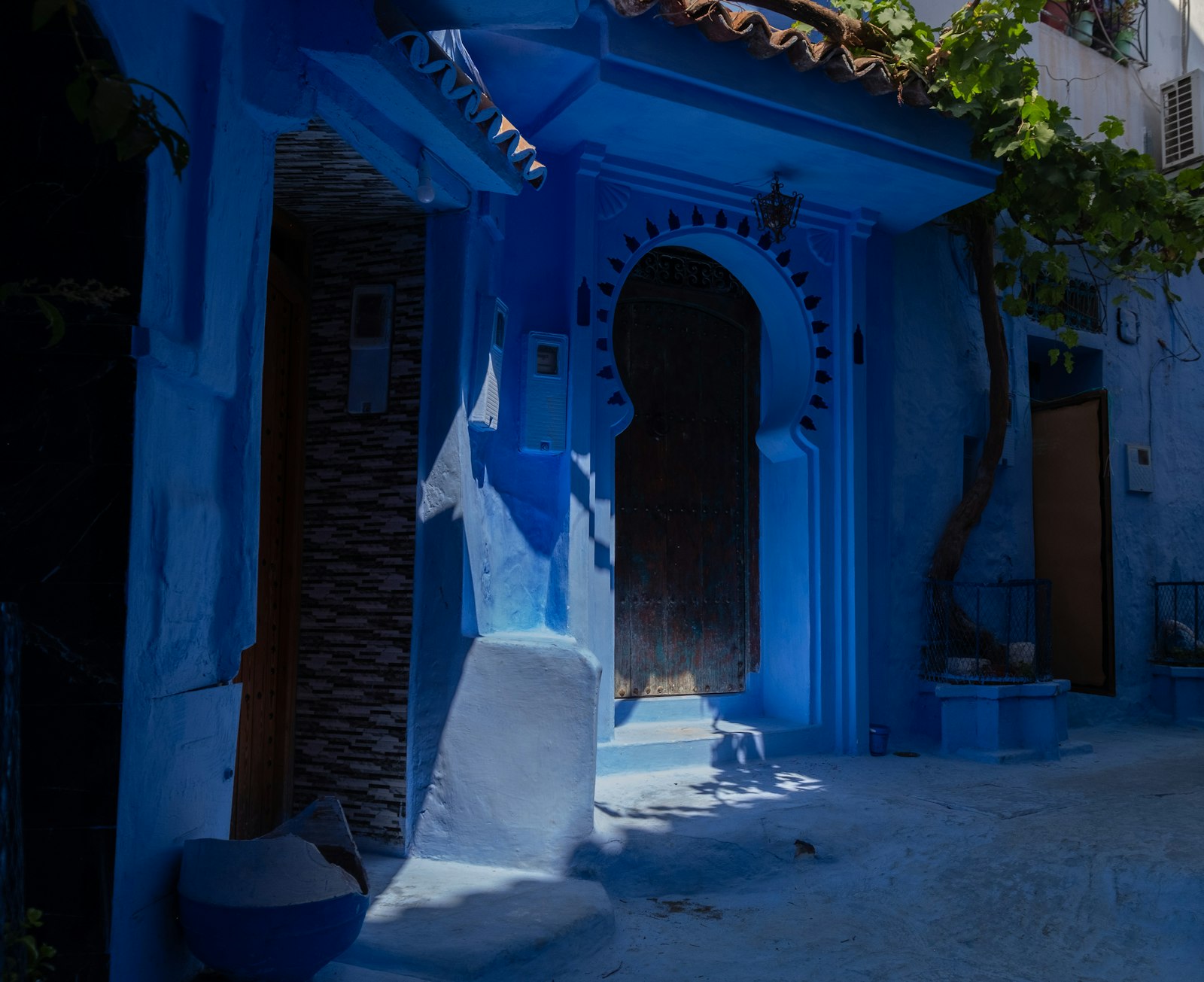 A vibrant blue doorway on a moroccan street.