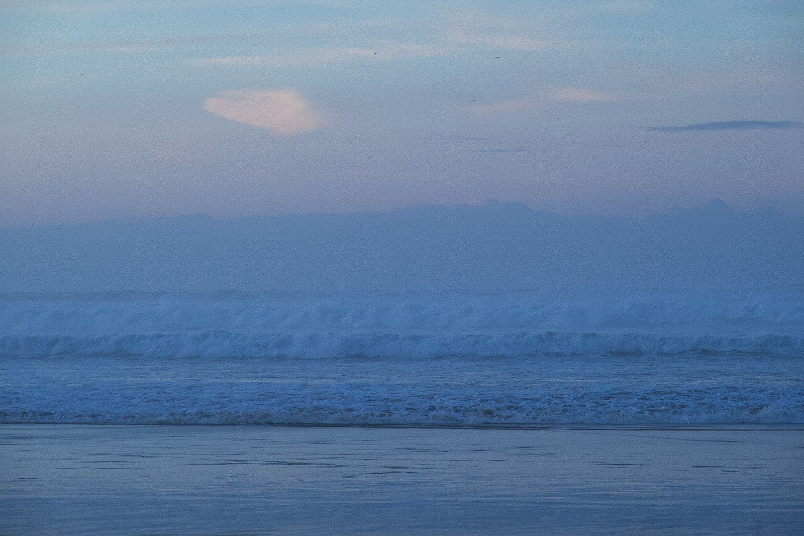 a person riding a surfboard on a wave in the ocean