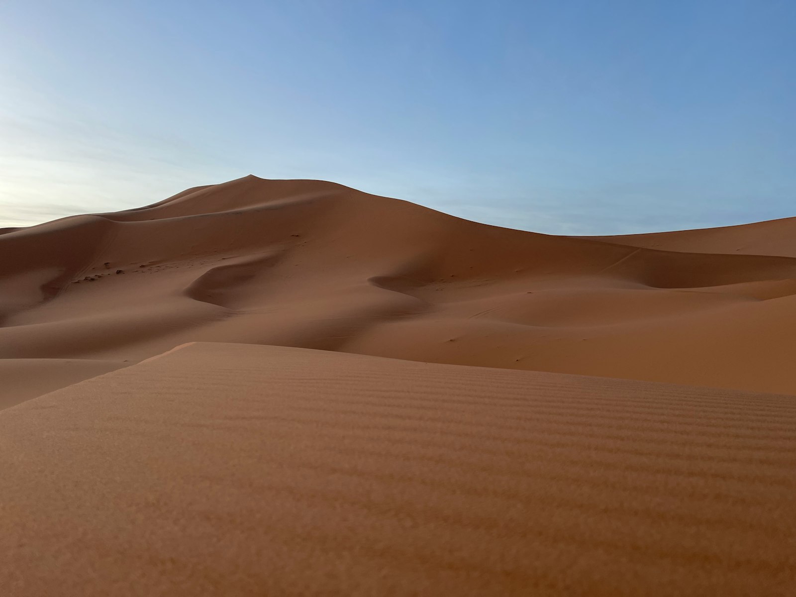 a large sand dune in the middle of a desert