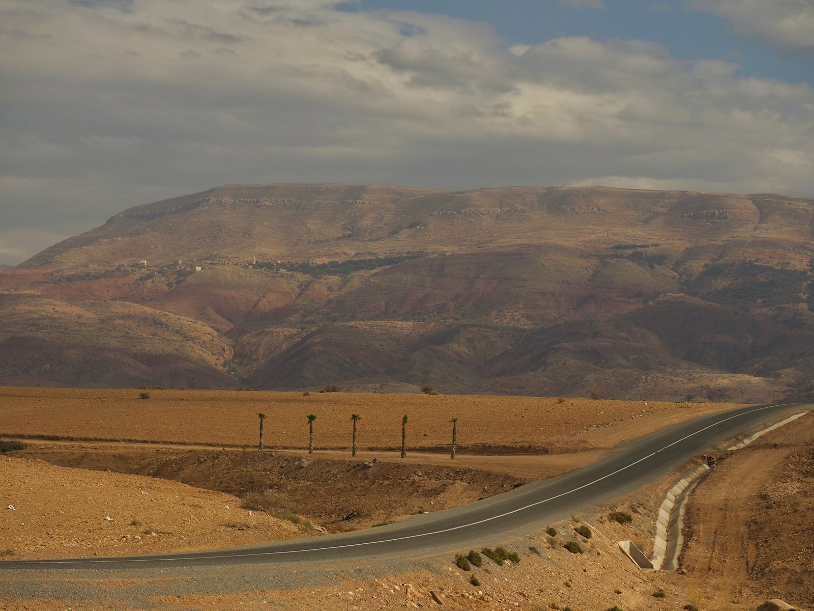 A winding road in the middle of a desert