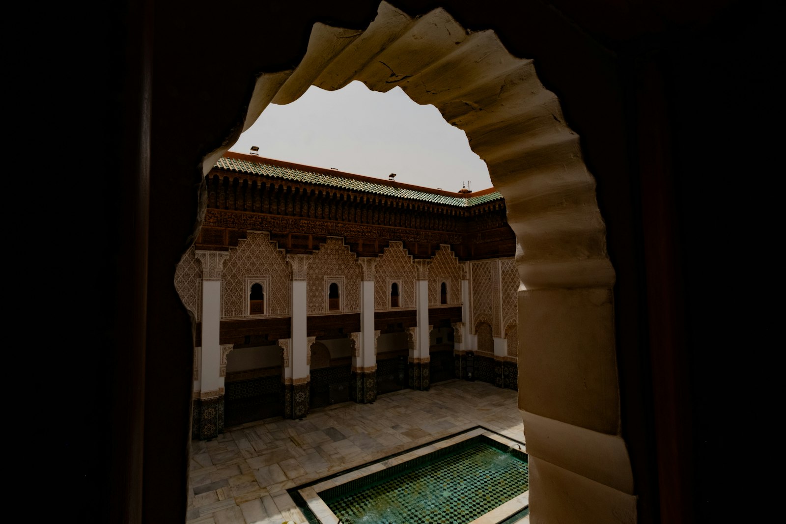 Courtyard with ornate arches and a pool