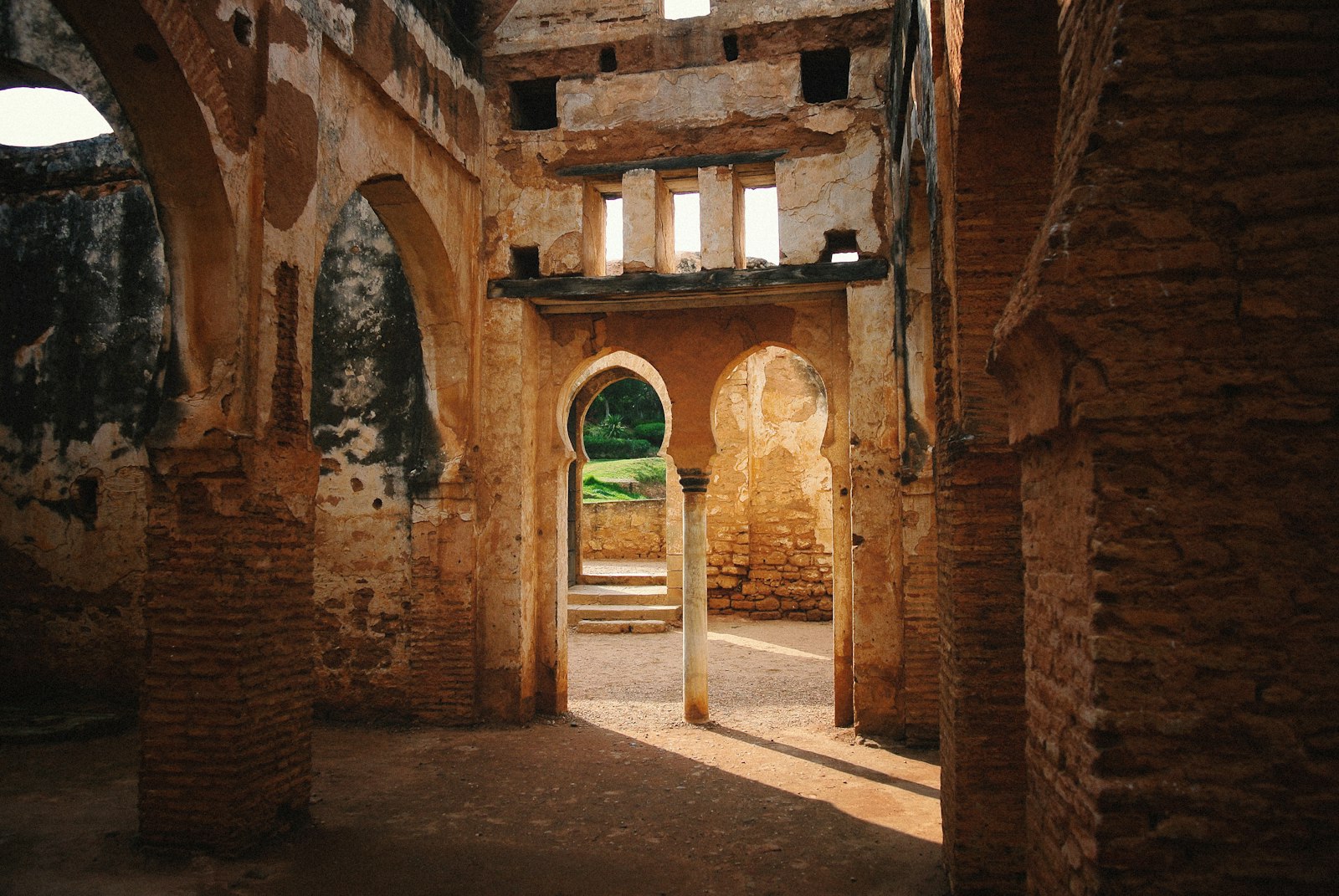 a doorway in an old building with stone walls and arches