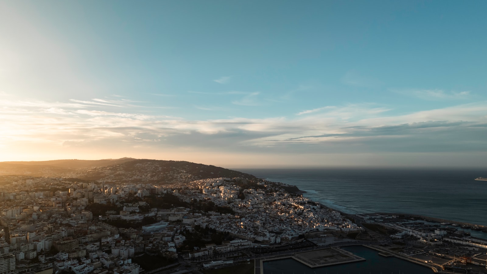 A bird's eye view of a city and the ocean