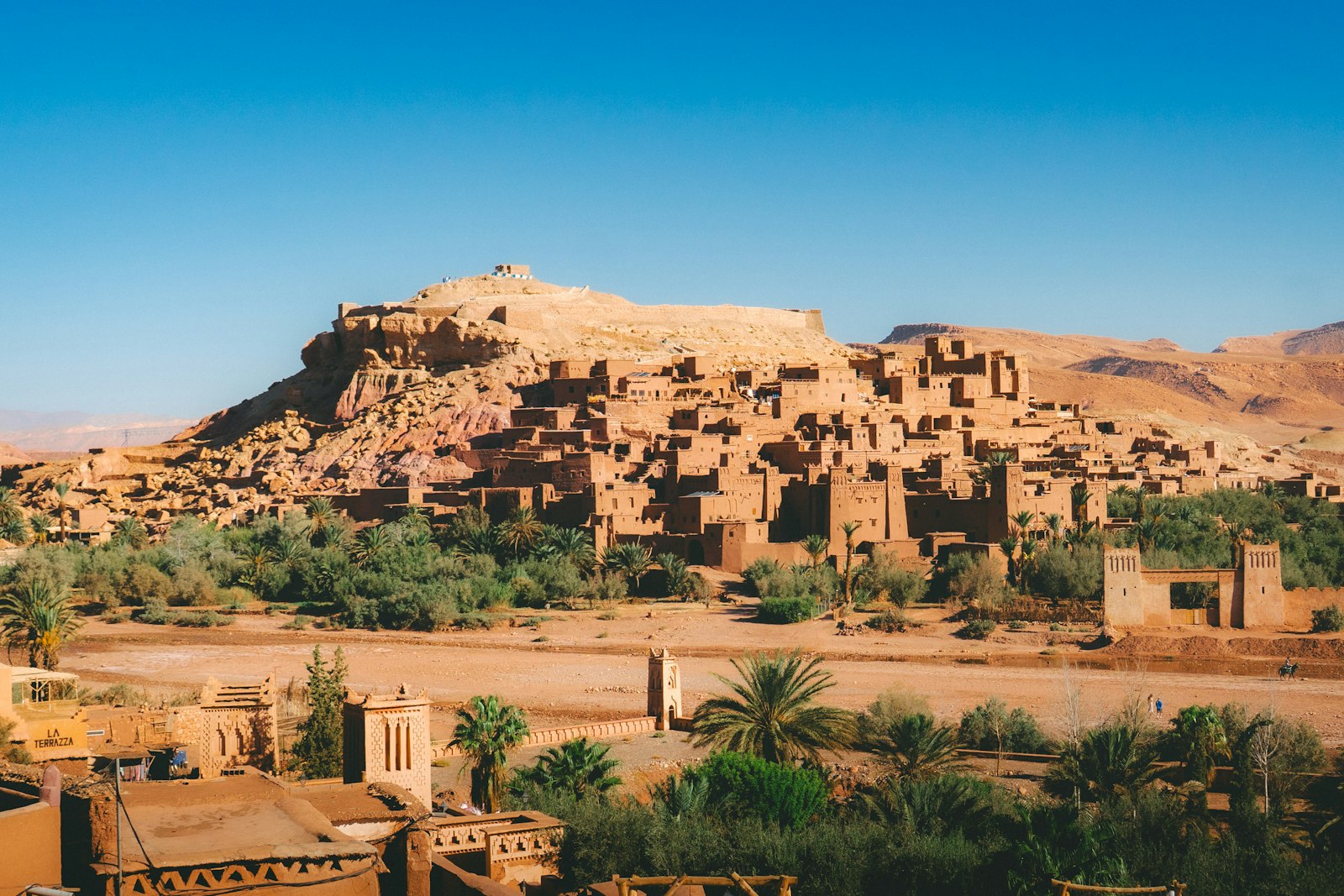 Ancient kasbah village nestled in a desert landscape.