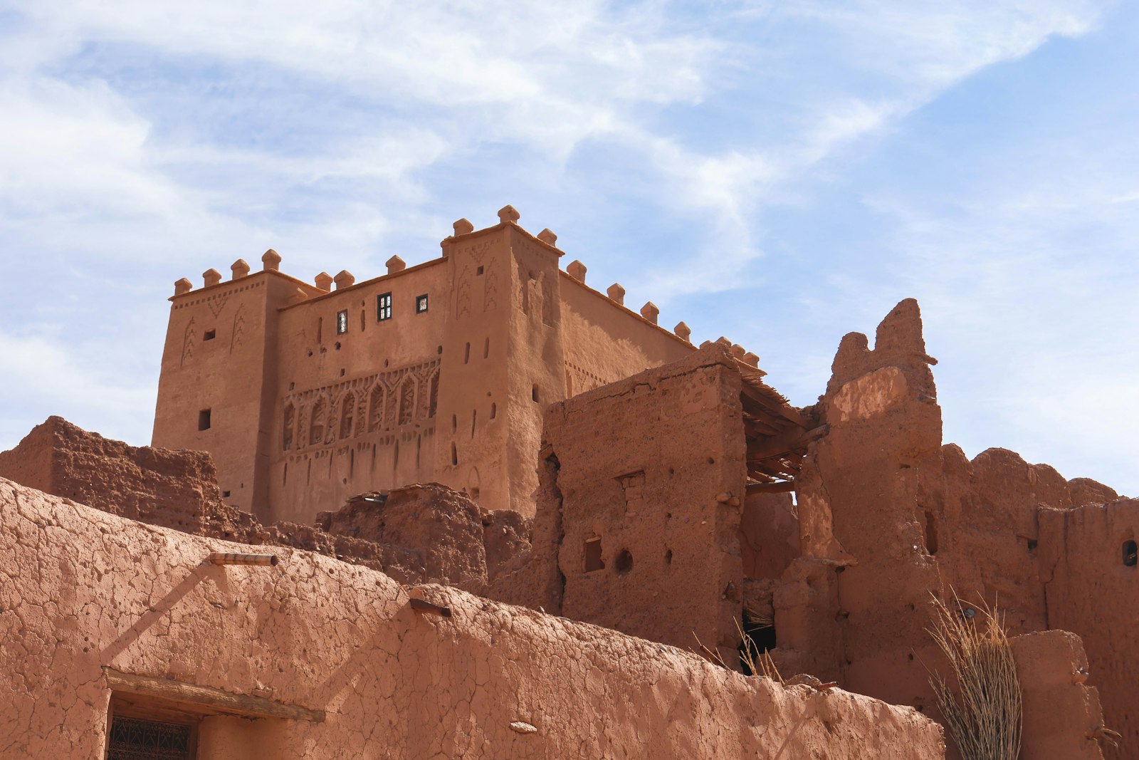 Ancient adobe kasbah against a blue sky
