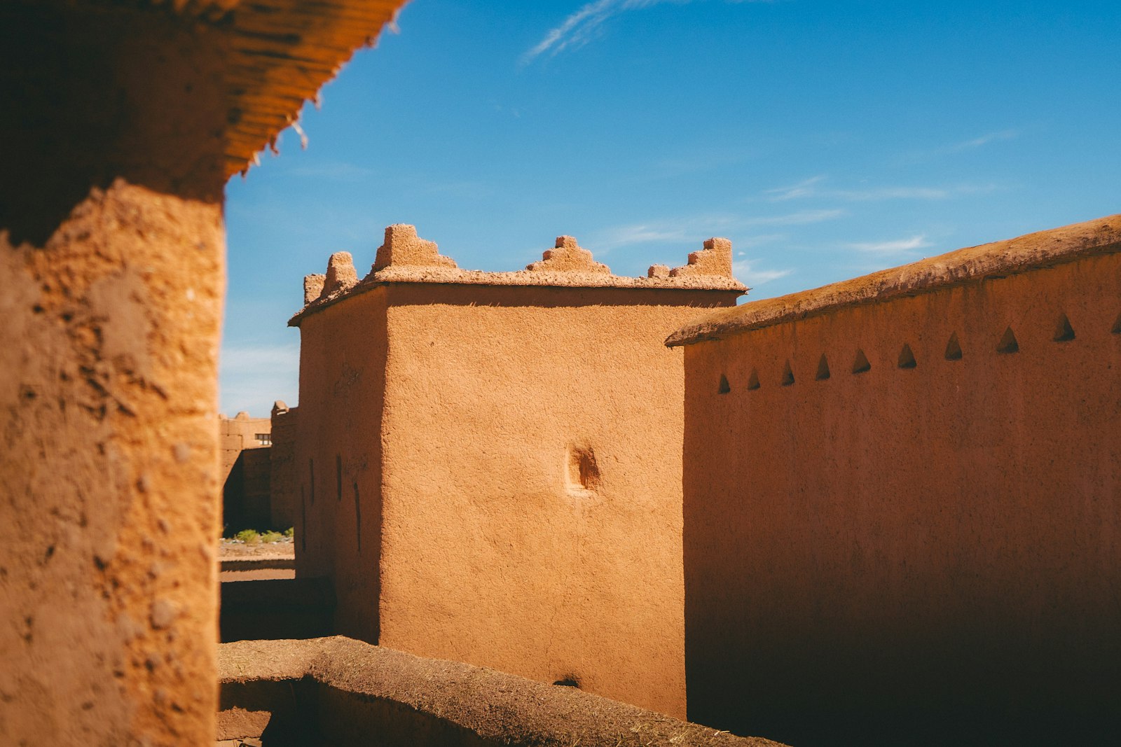 Ancient adobe buildings under a clear blue sky